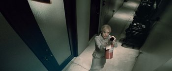 Movie still from “Salt” (2010), directed by Phillip Noyce – A woman taking a picture of herself with a camera; Medium shot, Overhead angle