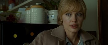 Movie still from “Salt” (2010), directed by Phillip Noyce – A person wearing a jacket; Close Up shot, Over the shoulder angle