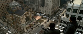 Movie still from “Salt” (2010), directed by Phillip Noyce – An aerial view of a street with a lot of people walking on it; Extreme Wide shot, High angle