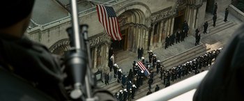 Movie still from “Salt” (2010), directed by Phillip Noyce – An american flag draped over the top of a building; Wide shot, High angle