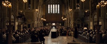 Movie still from “Salt” (2010), directed by Phillip Noyce – A crowd of people in a large room; Extreme Wide shot, High angle