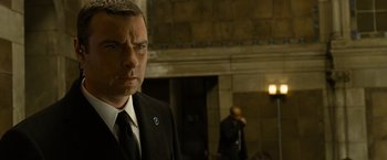 Movie still from “Salt” (2010), directed by Phillip Noyce – A man in a suit and tie; Close Up shot, Over the shoulder angle
