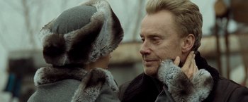 Movie still from “Salt” (2010), directed by Phillip Noyce – A person wearing a fur hat; Close Up shot, Over the shoulder angle