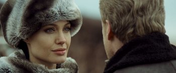 Movie still from “Salt” (2010), directed by Phillip Noyce – A man and a woman in a fur hat; Close Up shot, Over the shoulder angle