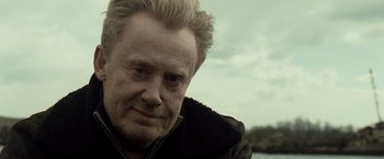 Movie still from “Salt” (2010), directed by Phillip Noyce – A person wearing a jacket; Close Up shot, Over the shoulder angle