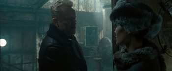 Movie still from “Salt” (2010), directed by Phillip Noyce – A man and a woman are standing next to each other; Close Up shot, Over the shoulder angle