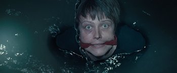 Movie still from “Salt” (2010), directed by Phillip Noyce – A woman with a red rope around her neck; Close Up shot, High angle