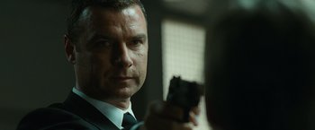 Movie still from “Salt” (2010), directed by Phillip Noyce – A person holding a gun; Close Up shot, Over the shoulder angle