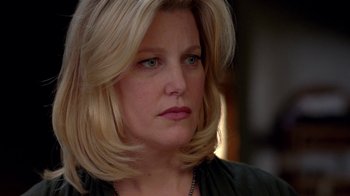 Movie still from “Breaking Bad” (2008), created by Vince Gilligan – A person with blonde hair; Close Up shot, Over the shoulder angle