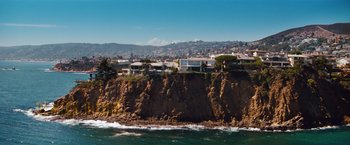 Movie still from “Savages” (2012), directed by Oliver Stone – A view of houses on the side of a cliff; Extreme Wide shot, High angle