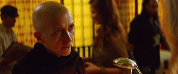 Movie still from “Savages” (2012), directed by Oliver Stone – A woman with a bald head sitting in front of a mirror; Close Up shot, Over the shoulder angle