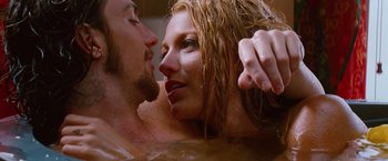 Movie still from “Savages” (2012), directed by Oliver Stone – A man and a woman in a bath tub; Close Up shot, Overhead angle