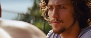 Movie still from “Savages” (2012), directed by Oliver Stone – A person with long hair; Close Up shot, Over the shoulder angle