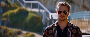 Movie still from “Savages” (2012), directed by Oliver Stone – A person wearing sunglasses; Close Up shot, Low angle
