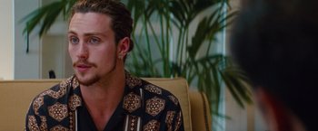 Movie still from “Savages” (2012), directed by Oliver Stone – A person sitting in a chair; Close Up shot, Over the shoulder angle