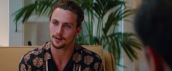 Movie still from “Savages” (2012), directed by Oliver Stone – A person sitting in a chair; Close Up shot, Over the shoulder angle