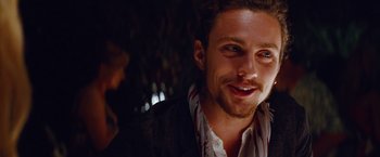 Movie still from “Savages” (2012), directed by Oliver Stone – A person smiling at the camera; Close Up shot, Over the shoulder angle