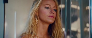 Movie still from “Savages” (2012), directed by Oliver Stone – A person with long hair; Close Up shot, Low angle