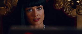 Movie still from “Savages” (2012), directed by Oliver Stone – A person wearing a necklace; Close Up shot, Over the shoulder angle