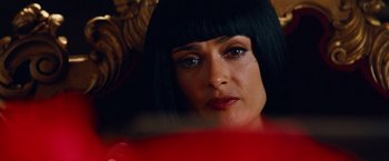 Movie still from “Savages” (2012), directed by Oliver Stone – A person with long black hair; Close Up shot, Over the shoulder angle