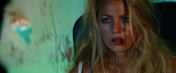 Movie still from “Savages” (2012), directed by Oliver Stone – A person with makeup on her face; Close Up shot, Low angle