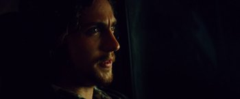 Movie still from “Savages” (2012), directed by Oliver Stone – A person looking at the camera; Close Up shot, Over the shoulder angle