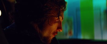 Movie still from “Savages” (2012), directed by Oliver Stone – A person's face in the dark; Close Up shot, Low angle