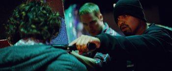 Movie still from “Savages” (2012), directed by Oliver Stone – A man cutting another man's hair with a pair of shears; Close Up shot, Over the shoulder angle