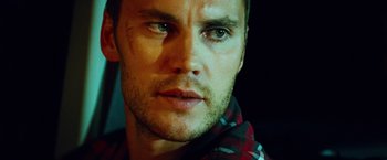Movie still from “Savages” (2012), directed by Oliver Stone – A man's face in a plaid shirt; Close Up shot, Over the shoulder angle