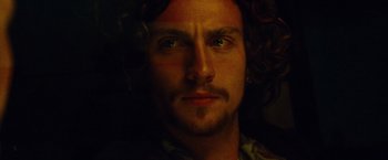 Movie still from “Savages” (2012), directed by Oliver Stone – A person with long hair; Close Up shot, Low angle