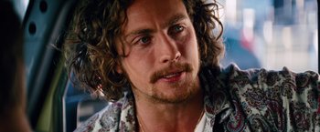 Movie still from “Savages” (2012), directed by Oliver Stone – A person with long hair; Close Up shot, Over the shoulder angle