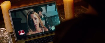 Movie still from “Savages” (2012), directed by Oliver Stone – A laptop computer sitting on top of a wooden desk; Close Up shot, High angle