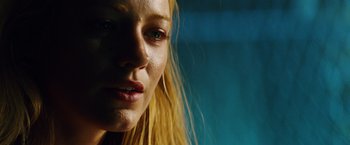 Movie still from “Savages” (2012), directed by Oliver Stone – A woman's face with long blonde hair; Close Up shot, Low angle