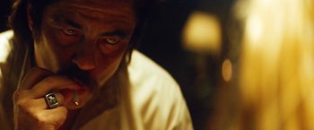 Movie still from “Savages” (2012), directed by Oliver Stone – A person's face with a blurry background; Close Up shot, Low angle