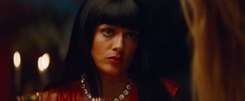 Movie still from “Savages” (2012), directed by Oliver Stone – A person with long black hair; Close Up shot, Over the shoulder angle