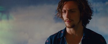 Movie still from “Savages” (2012), directed by Oliver Stone – A person with long hair; Close Up shot, Low angle