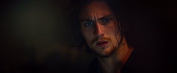 Movie still from “Savages” (2012), directed by Oliver Stone – A person with long hair; Close Up shot, Low angle