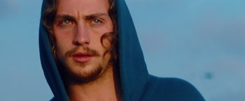 Movie still from “Savages” (2012), directed by Oliver Stone – A person wearing a hooded sweatshirt; Close Up shot, Low angle