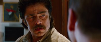 Movie still from “Savages” (2012), directed by Oliver Stone – A person wearing a shirt; Close Up shot, Over the shoulder angle