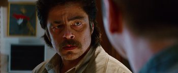 Movie still from “Savages” (2012), directed by Oliver Stone – A person wearing a shirt; Close Up shot, Over the shoulder angle