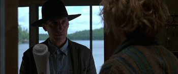 Movie still from “Secret Window” (2004), directed by David Koepp – A man wearing a hat and a jacket standing next to a woman; Close Up shot, Over the shoulder angle