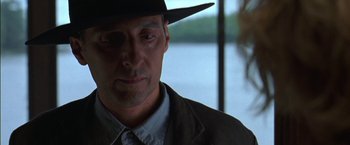 Movie still from “Secret Window” (2004), directed by David Koepp – A man wearing a black hat and a suit; Close Up shot, Low angle