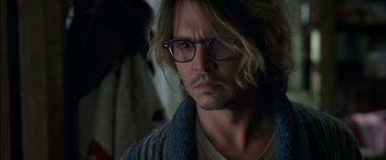 Movie still from “Secret Window” (2004), directed by David Koepp – A man with long blonde hair wearing glasses; Close Up shot, Over the shoulder angle