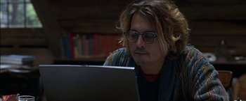 Movie still from “Secret Window” (2004), directed by David Koepp – A man with glasses is looking at a computer screen; Close Up shot, High angle