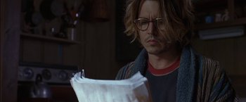 Movie still from “Secret Window” (2004), directed by David Koepp – A person reading a piece of paper; Close Up shot, Over the shoulder angle