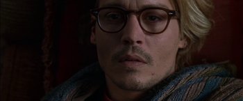 Movie still from “Secret Window” (2004), directed by David Koepp – A person wearing glasses and a jacket; Close Up shot, High angle