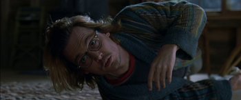Movie still from “Secret Window” (2004), directed by David Koepp – A man with long blonde hair wearing glasses and a sweater; Close Up shot, Overhead angle