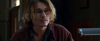 Movie still from “Secret Window” (2004), directed by David Koepp – A man with long blonde hair wearing glasses; Close Up shot, Over the shoulder angle