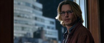 Movie still from “Secret Window” (2004), directed by David Koepp – A man with long blonde hair wearing glasses; Close Up shot, Over the shoulder angle