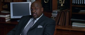 Movie still from “Secret Window” (2004), directed by David Koepp – A man in a suit sitting in front of a computer; Medium shot, High angle